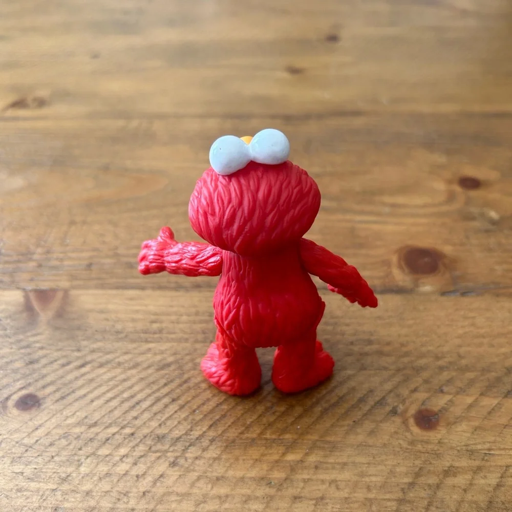 Applause Elmo figurine as is can be used as a cake topper